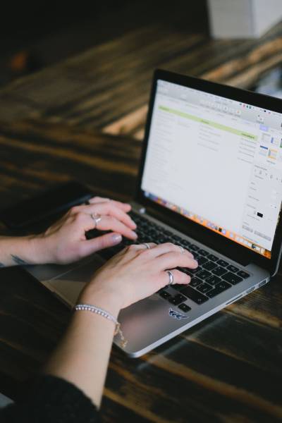 Open laptop on desk in creating digital product